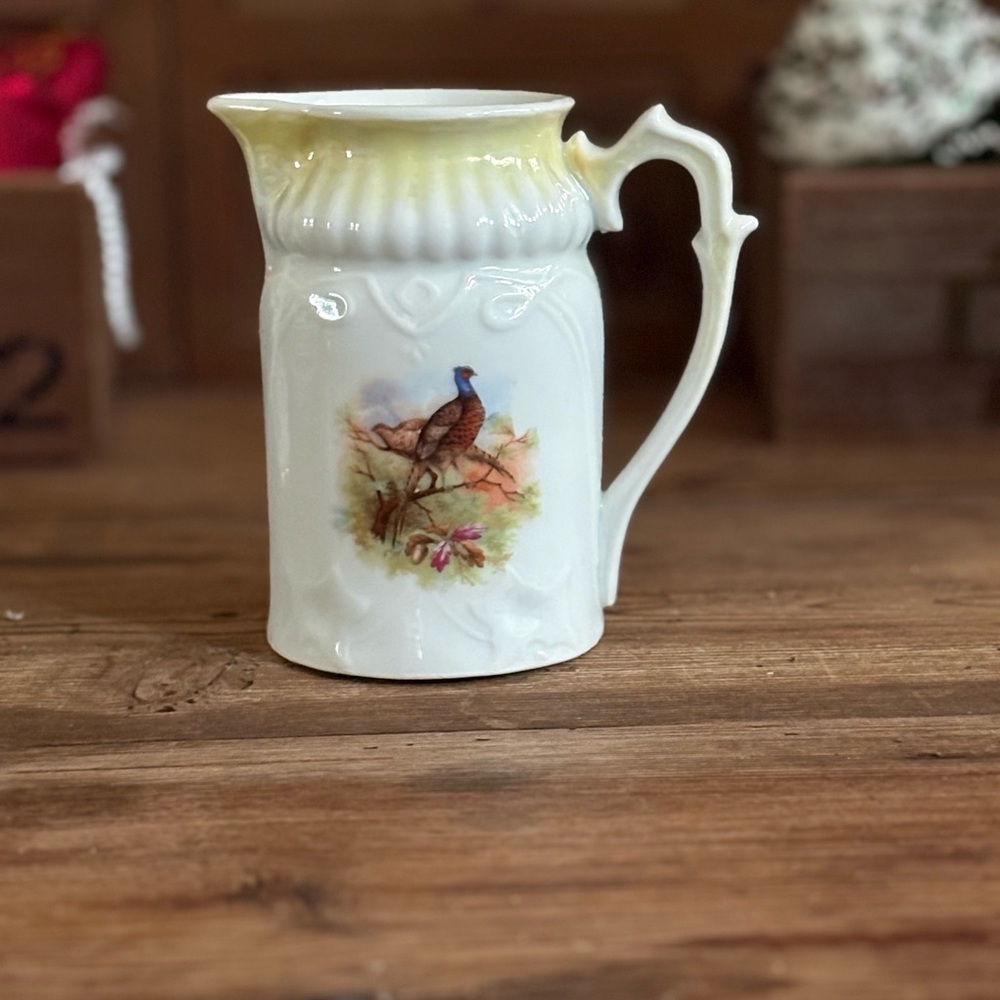 Elegant White and Yellow Ceramic Pitcher with Bird Design
